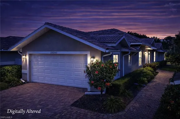 a front view of house with a garden