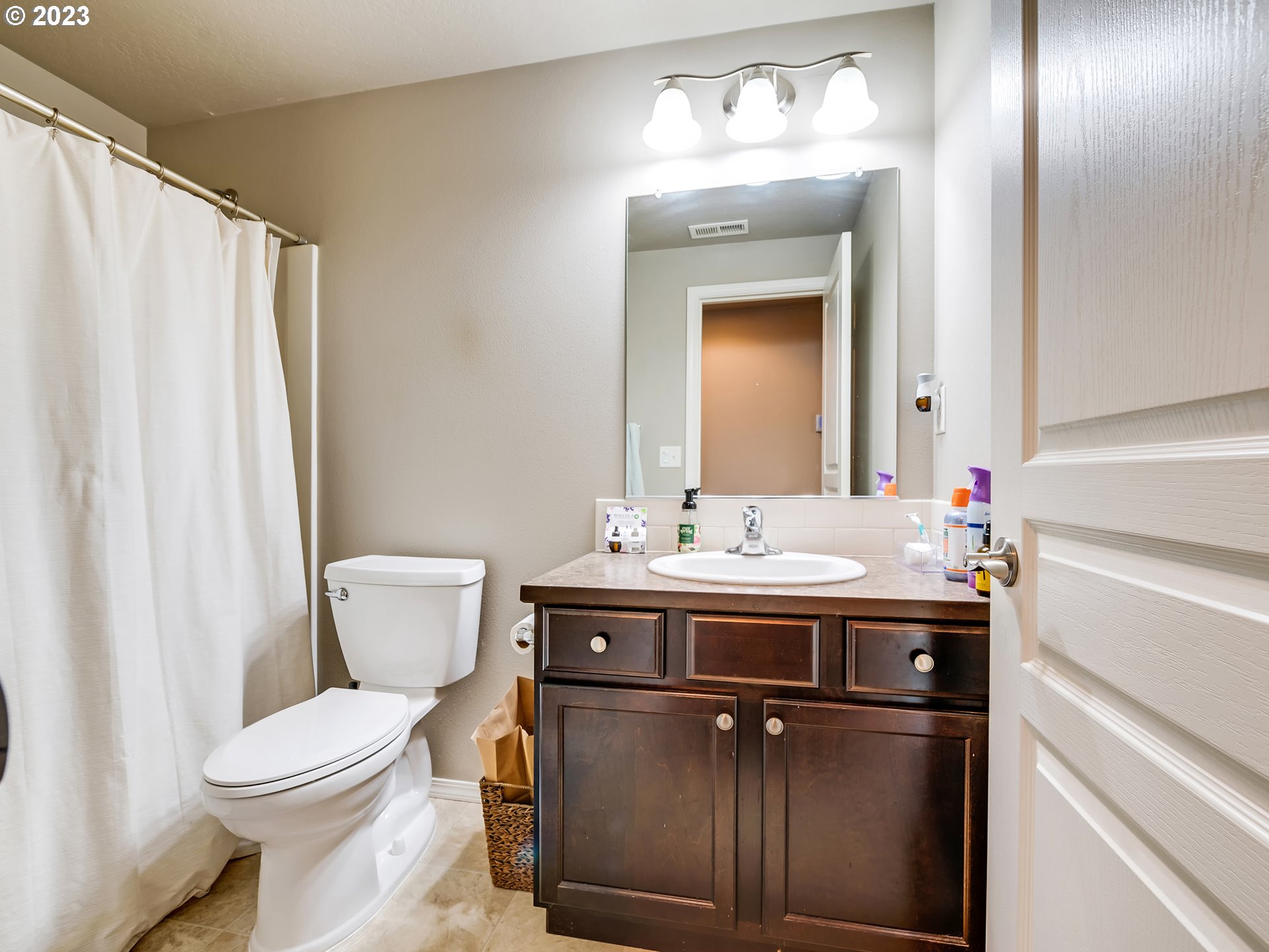 3657 Phantom Way Eugene, OR 97402 - Photo 13 of 18 a bathroom with a sink a toilet and a mirror