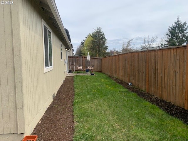 3657 Phantom Way Eugene, OR 97402 - Photo 18 of 18 a view of a backyard with wooden fence