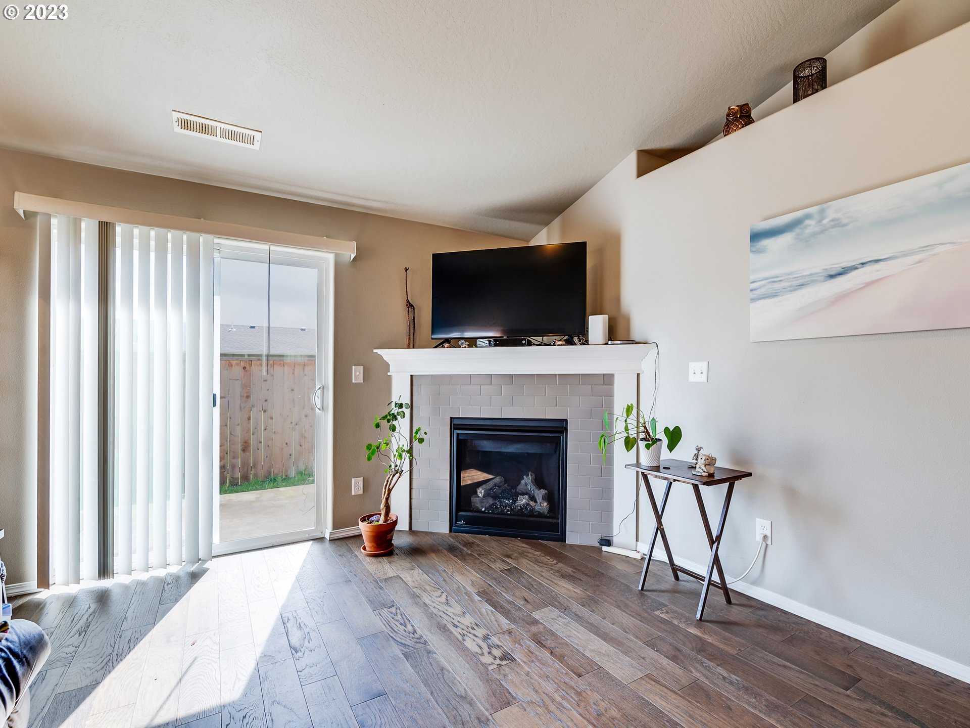 3657 Phantom Way Eugene, OR 97402 - Photo 3 of 18 a living room with furniture a fireplace and a flat screen tv