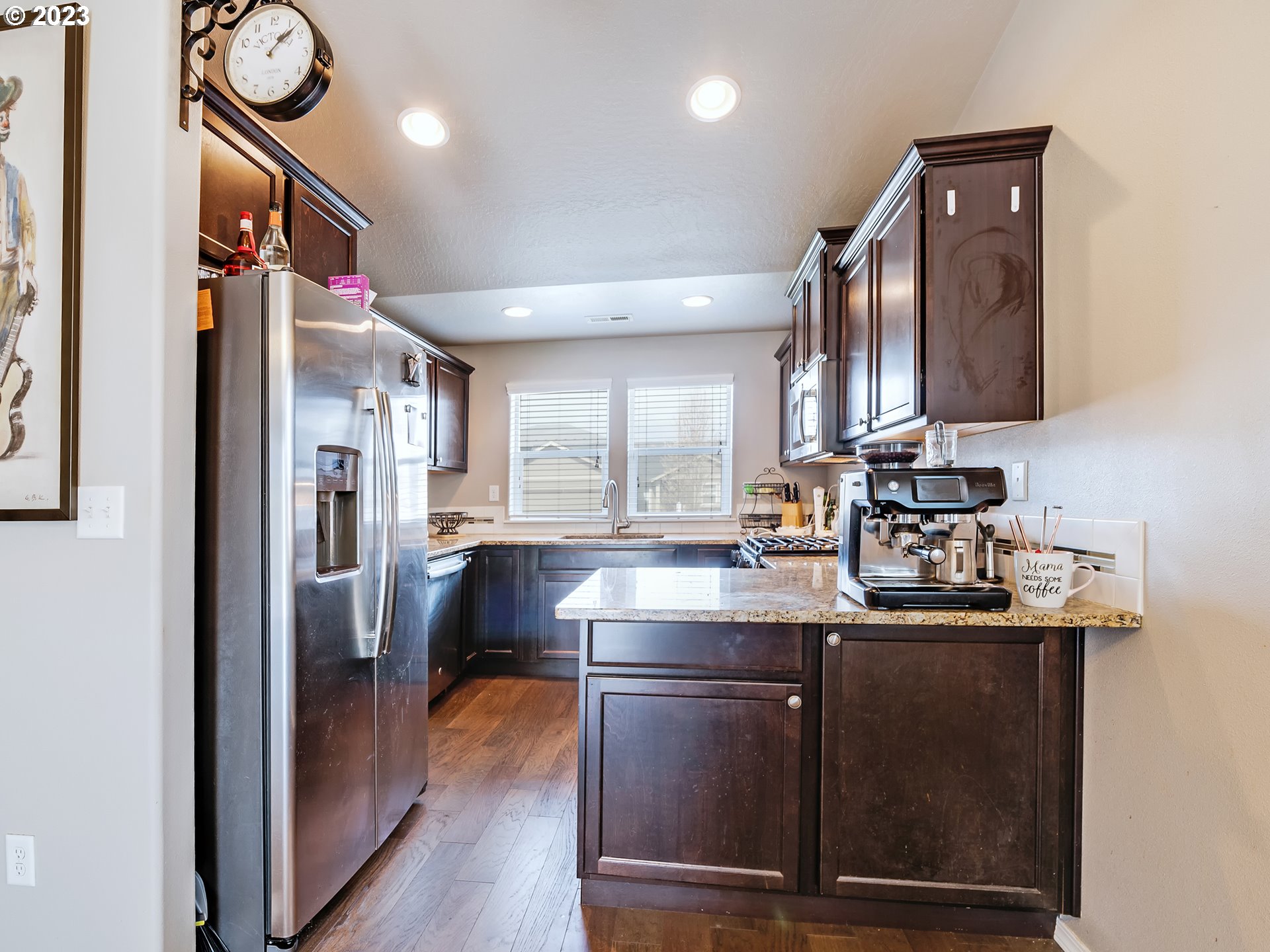 3657 Phantom Way Eugene, OR 97402 - Photo 7 of 18 a kitchen with stainless steel appliances granite countertop a sink stove and refrigerator