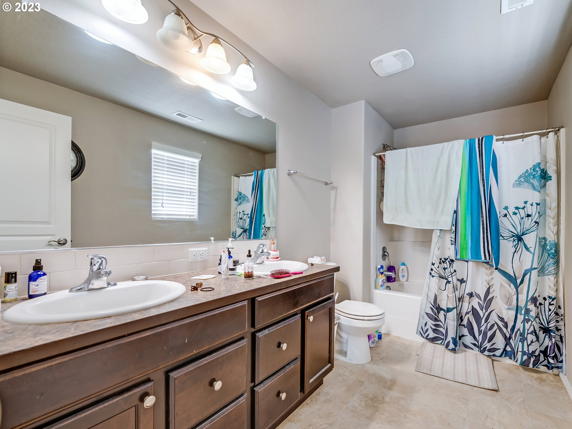 3657 Phantom Way Eugene, OR 97402 - Photo 10 of 18 a bathroom with a sink mirror and a toilet