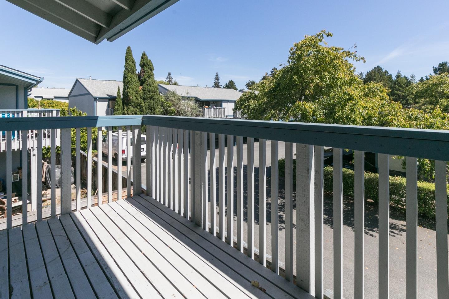 1925 46th Avenue, Unit 110 Capitola, CA 95010 - Photo 11 of 18 a view of a balcony with wooden floor