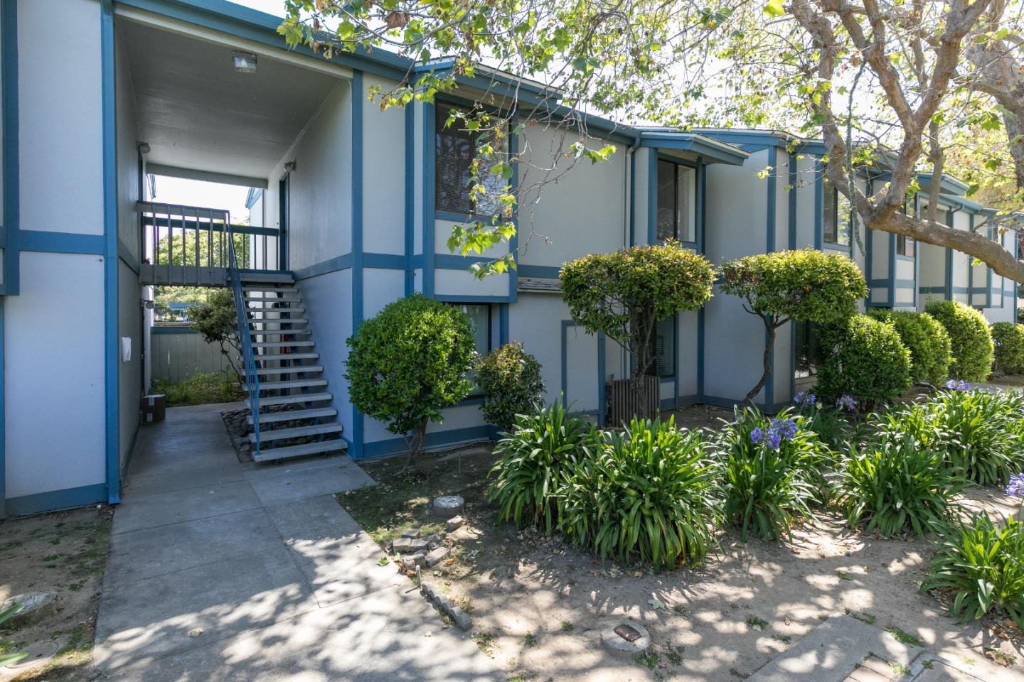 1925 46th Avenue, Unit 110 Capitola, CA 95010 - Photo 12 of 18 a view of a house with a garden