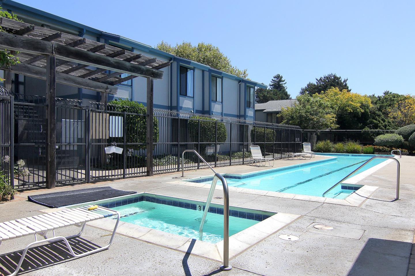 1925 46th Avenue, Unit 110 Capitola, CA 95010 - Photo 14 of 18 a view of backyard with swimming pool and seating area