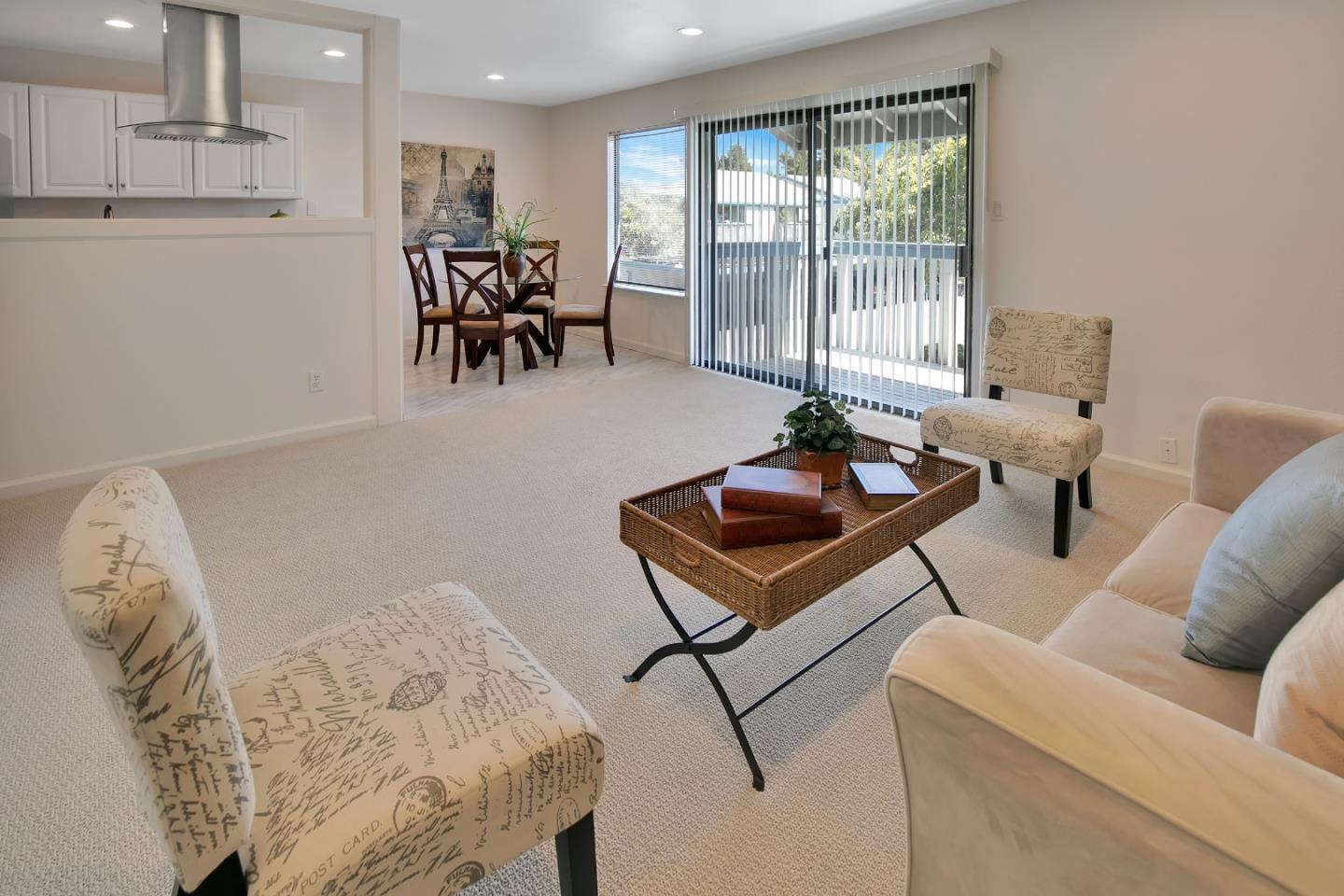1925 46th Avenue, Unit 110 Capitola, CA 95010 - Photo 5 of 18 a living room with furniture and a table