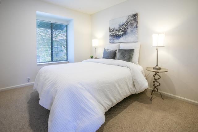 1925 46th Avenue, Unit 110 Capitola, CA 95010 - Photo 8 of 18 a bedroom with a bed and a window