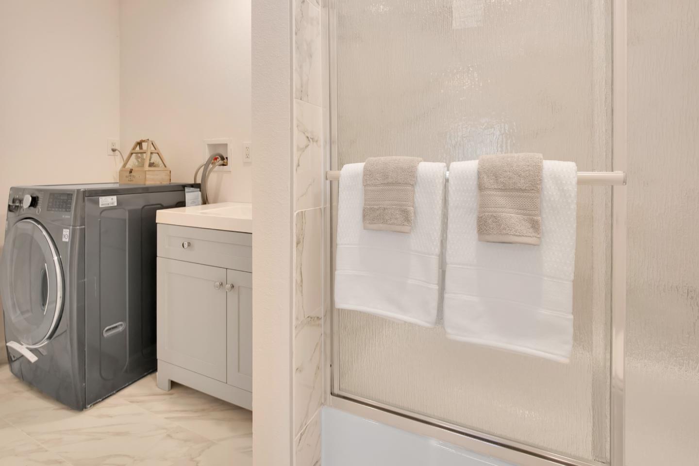 1925 46th Avenue, Unit 110 Capitola, CA 95010 - Photo 9 of 18 a bathroom with a bathtub and shower