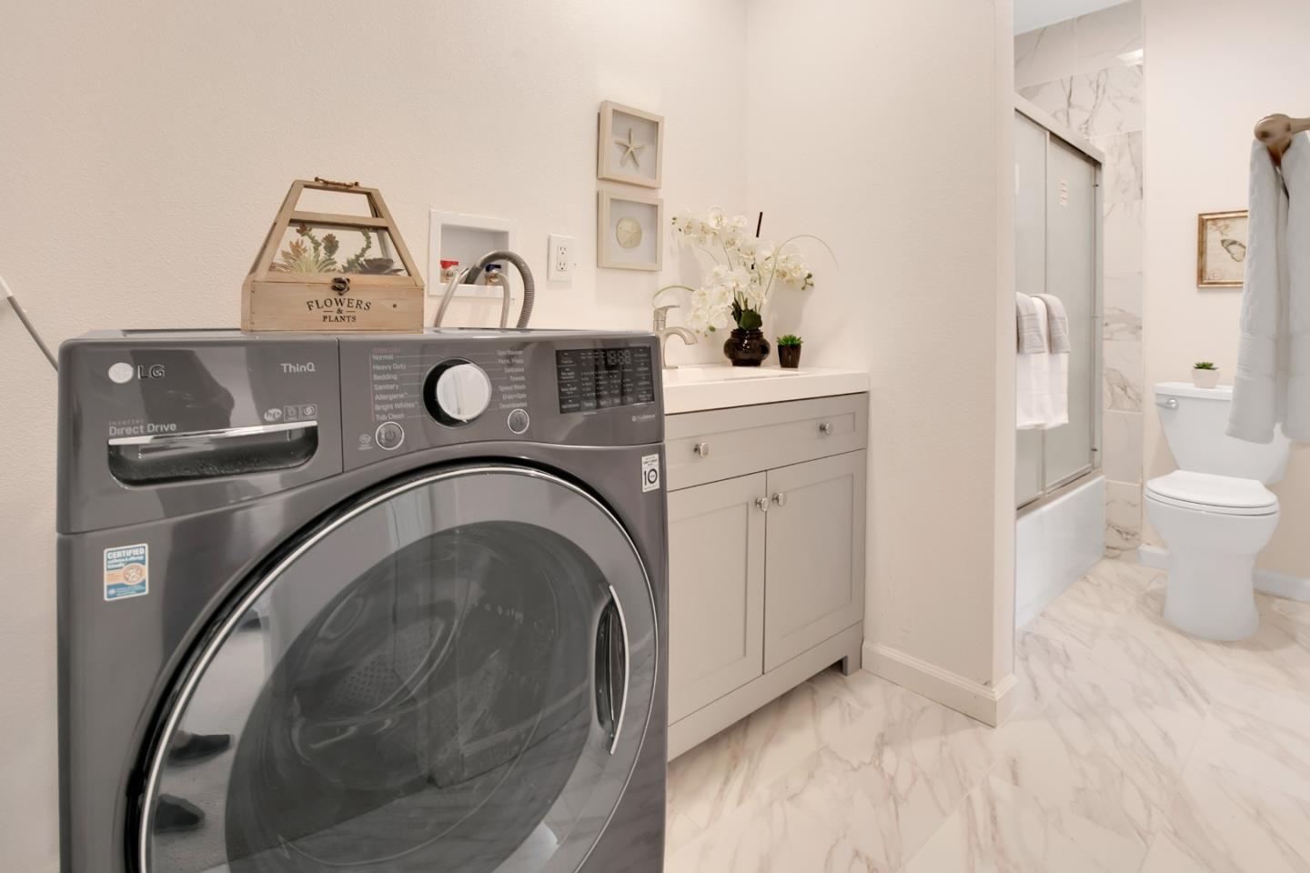 1925 46th Avenue, Unit 110 Capitola, CA 95010 - Photo 10 of 18 a utility room with dryer and washer