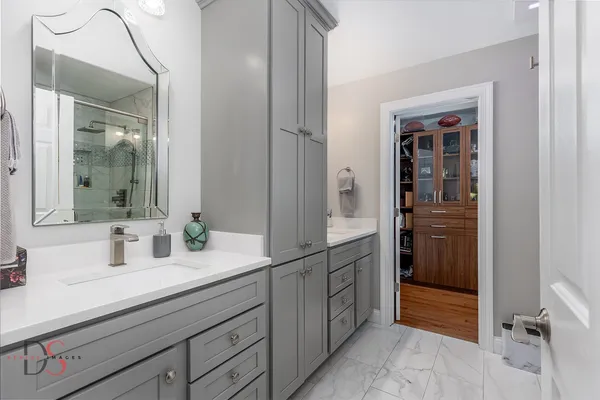 a bathroom with a sink and a mirror