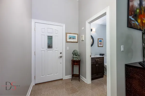 hallway with two windows and a painting on the wall