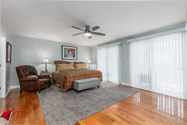 a bedroom with bed and window