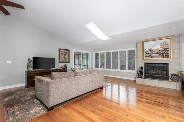 a living room with furniture and a flat screen tv