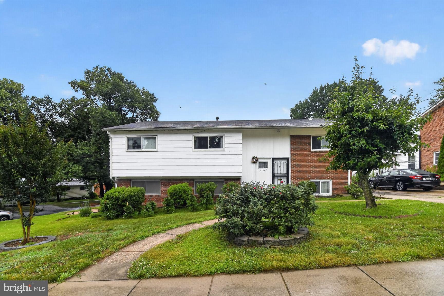 Charming split-level home with greenery.