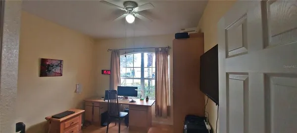 a room with a chair and a window