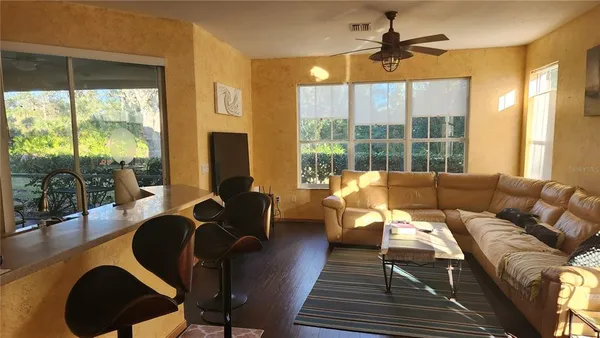 a living room with furniture and a large window
