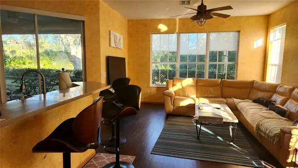 a living room with furniture and a large window