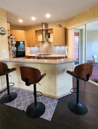 a kitchen with counter top space cabinets and stainless steel appliances