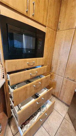 a kitchen with stainless steel appliances a refrigerator and cabinets