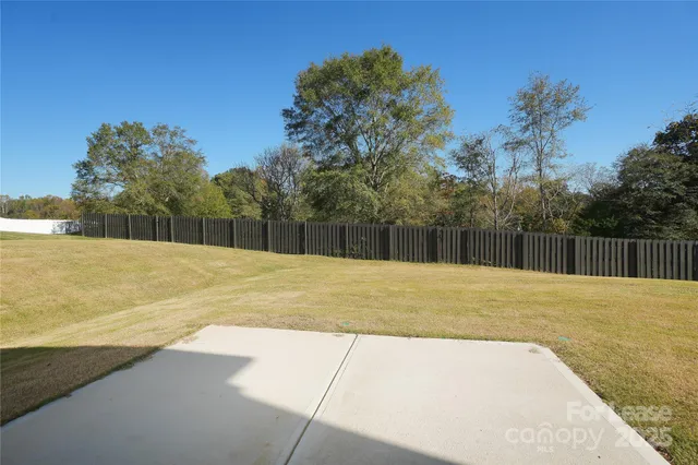 a view of a swimming pool with a yard