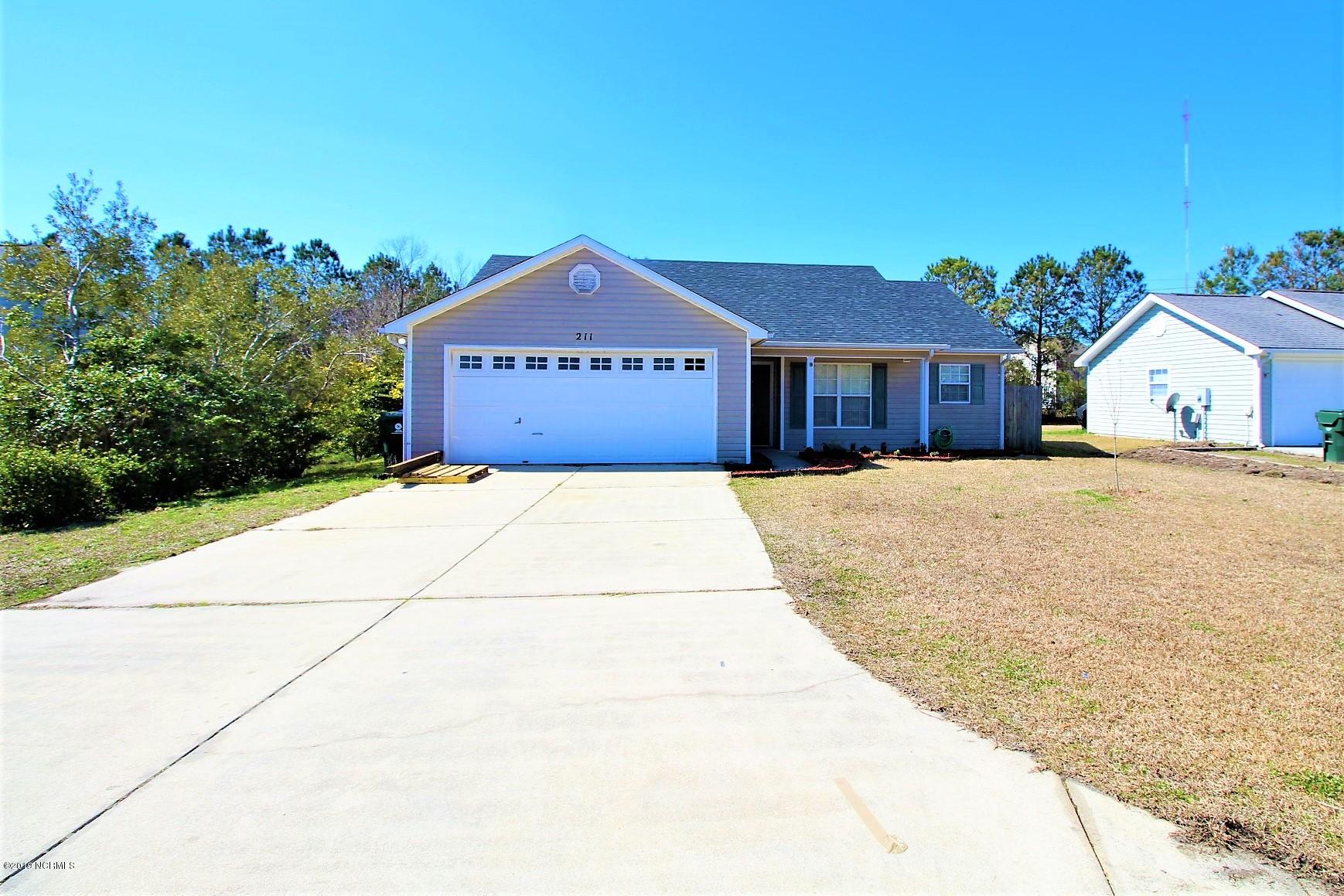 211 Foxhall Road Newport, NC 28570 - Photo 2 of 49 Front exterior - 2 car garage