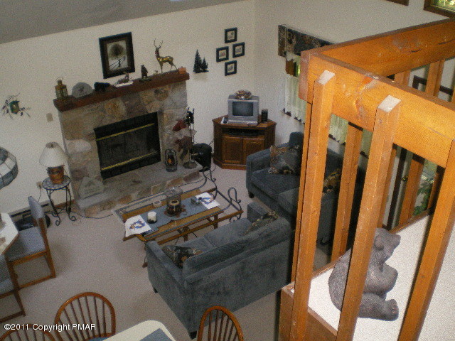 335 Fawn Road Pocono Lake, PA 18347 - Photo 3 of 12 a living room with furniture and a fireplace