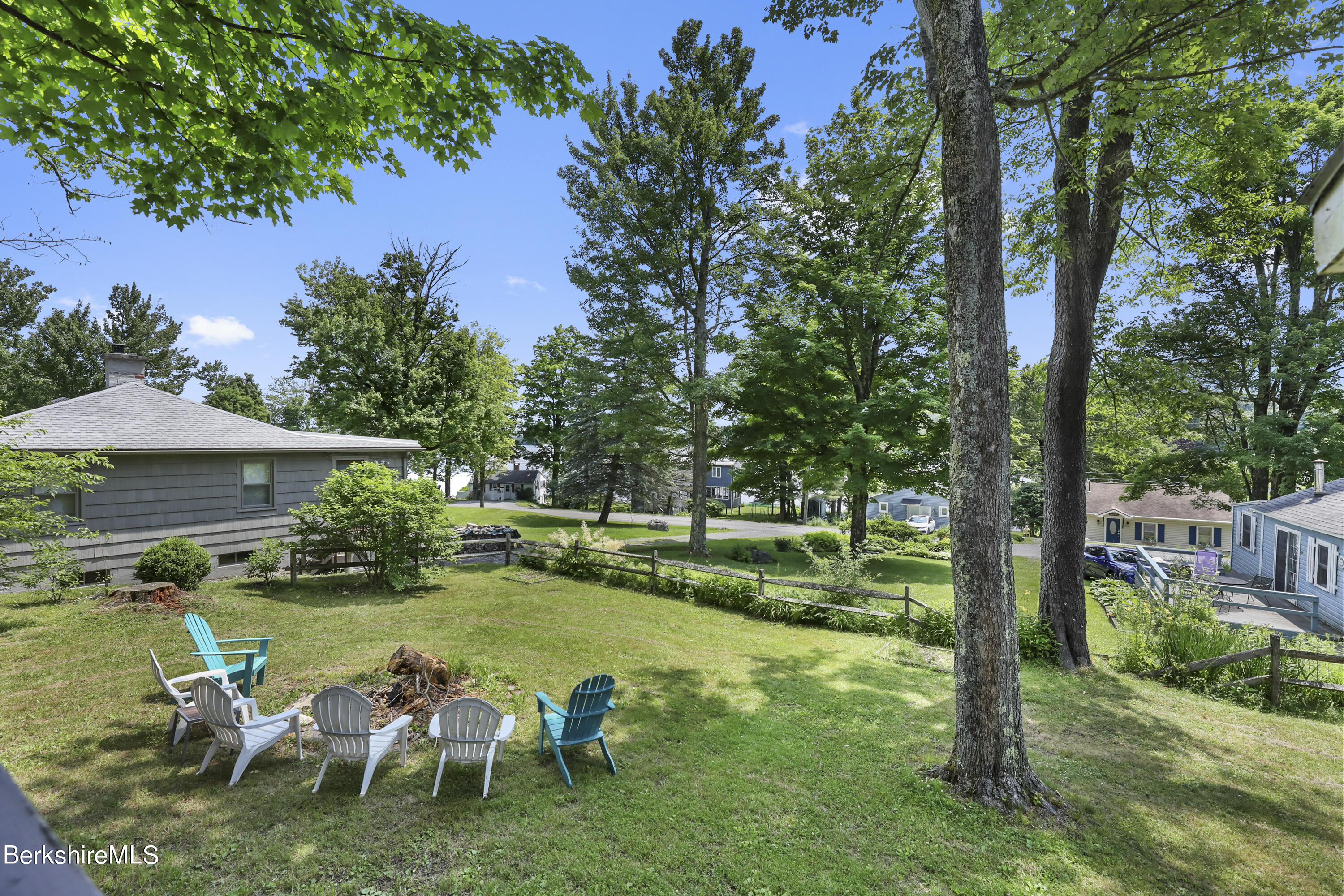 100 Chestnut Road Richmond, MA 01201 - Photo 3 of 37 a backyard of a house with yard table and chairs