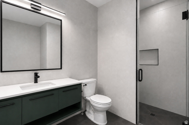 1429 Chateau Ridge Way Sandy, UT 84092 - Photo 11 of 22 Modern bathroom featuring a dark green vanity with a white countertop and integrated sink