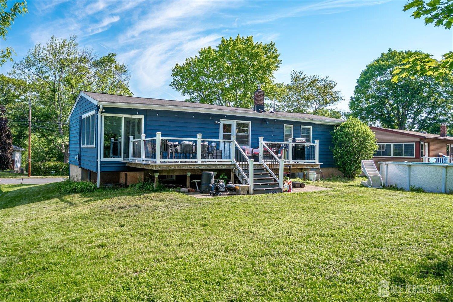 12 Gales Road Edison, NJ 08837 - Photo 33 of 35 a view of a house with a yard and sitting area