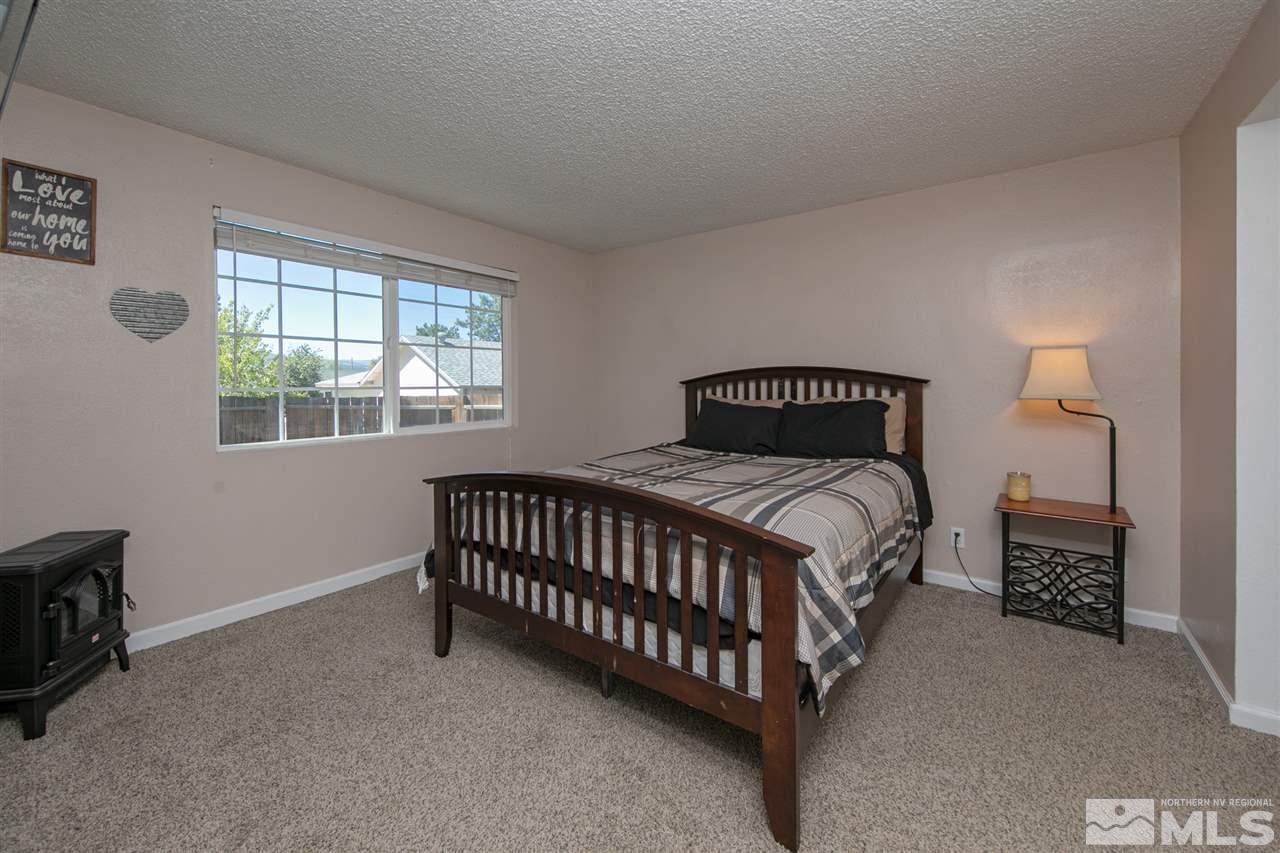 3600 Peregrine Court Reno, NV 89508 - Photo 12 of 36 a bedroom with a bed and a window