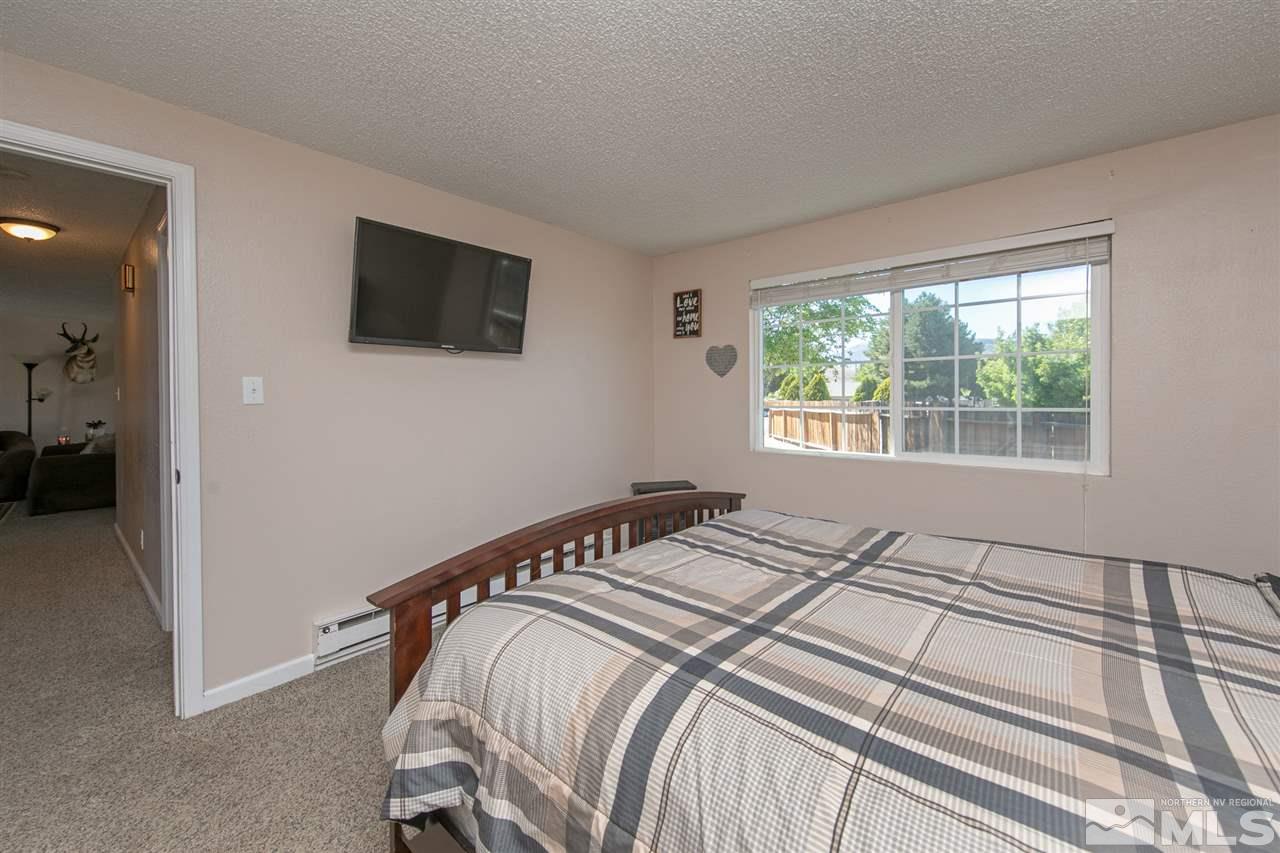 3600 Peregrine Court Reno, NV 89508 - Photo 13 of 36 a bedroom with a bed and a tv