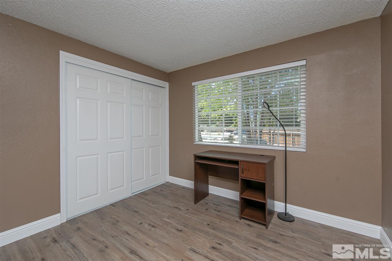 3600 Peregrine Court Reno, NV 89508 - Photo 14 of 36 a view of room with hardwood floor and workspace