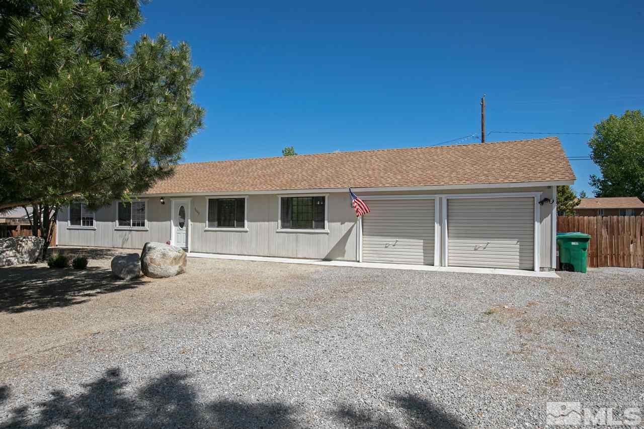 3600 Peregrine Court Reno, NV 89508 - Photo 30 of 36 a front view of a house with a yard and garage