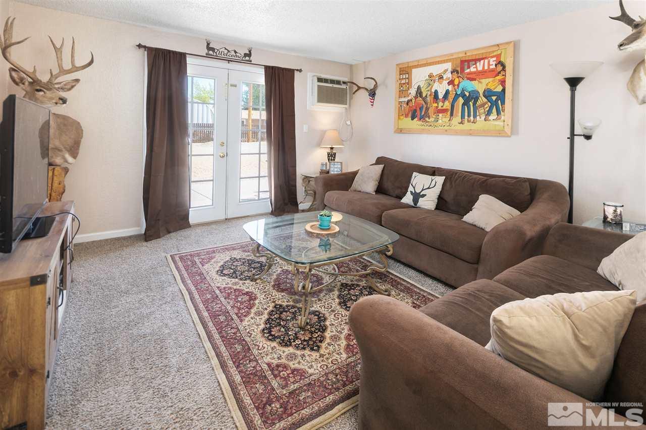 3600 Peregrine Court Reno, NV 89508 - Photo 3 of 36 a living room with furniture and a flat screen tv