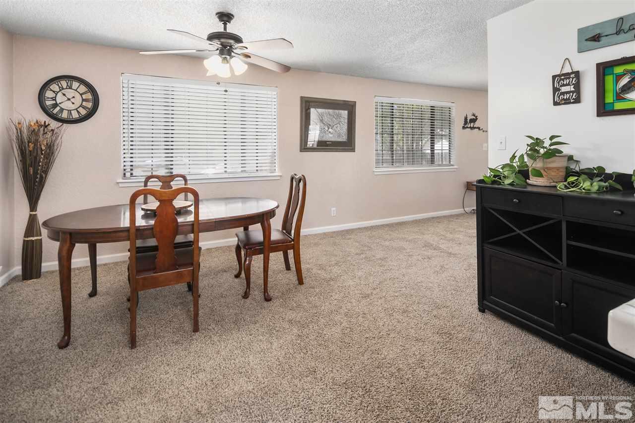 3600 Peregrine Court Reno, NV 89508 - Photo 8 of 36 a view of a dining room with furniture and chandelier