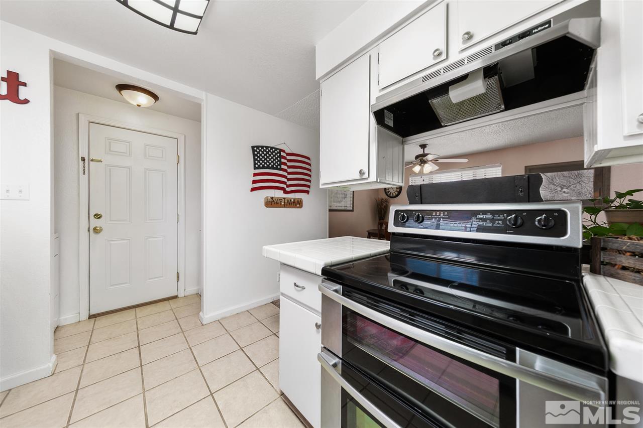 3600 Peregrine Court Reno, NV 89508 - Photo 10 of 36 a stove top oven sitting inside of a kitchen