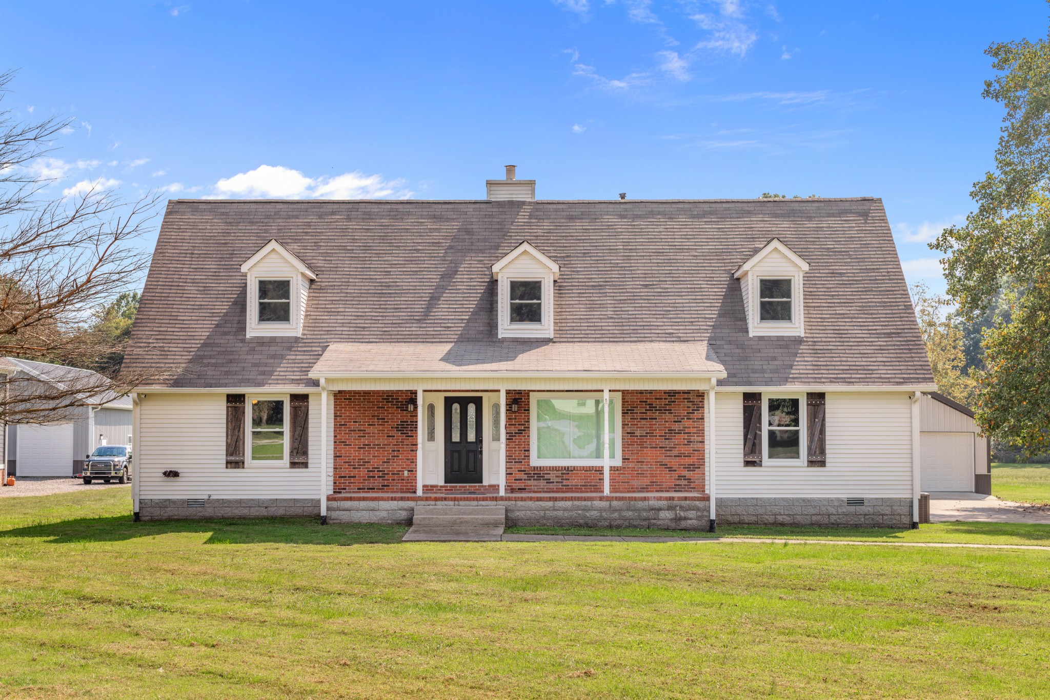 340 Double Log Cabin Road Lebanon, TN 37087 - Photo 1 of 50 a front view of a house with a garden