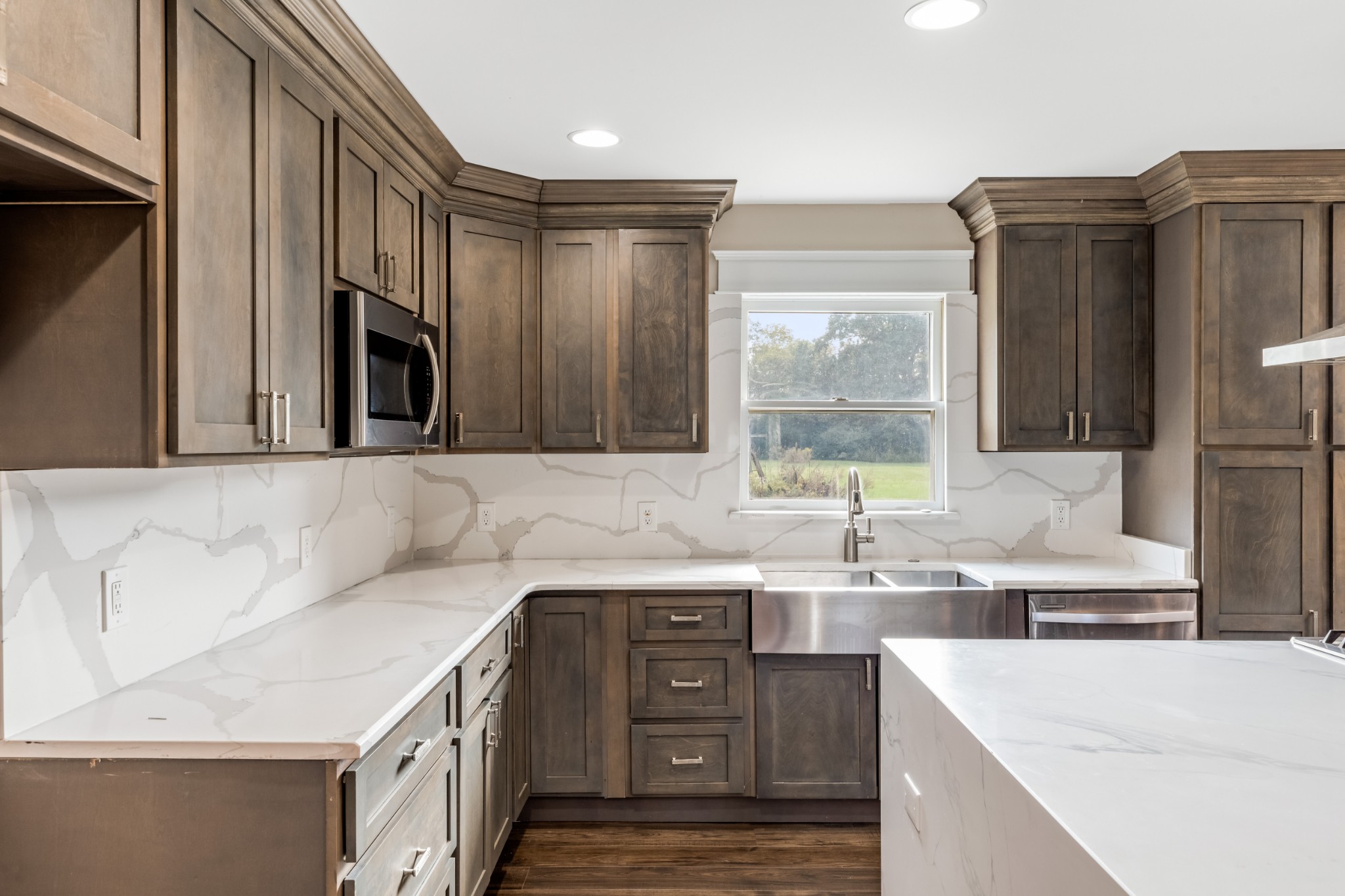 340 Double Log Cabin Road Lebanon, TN 37087 - Photo 11 of 50 a kitchen with a sink dishwasher a stove and a refrigerator with wooden cabinets