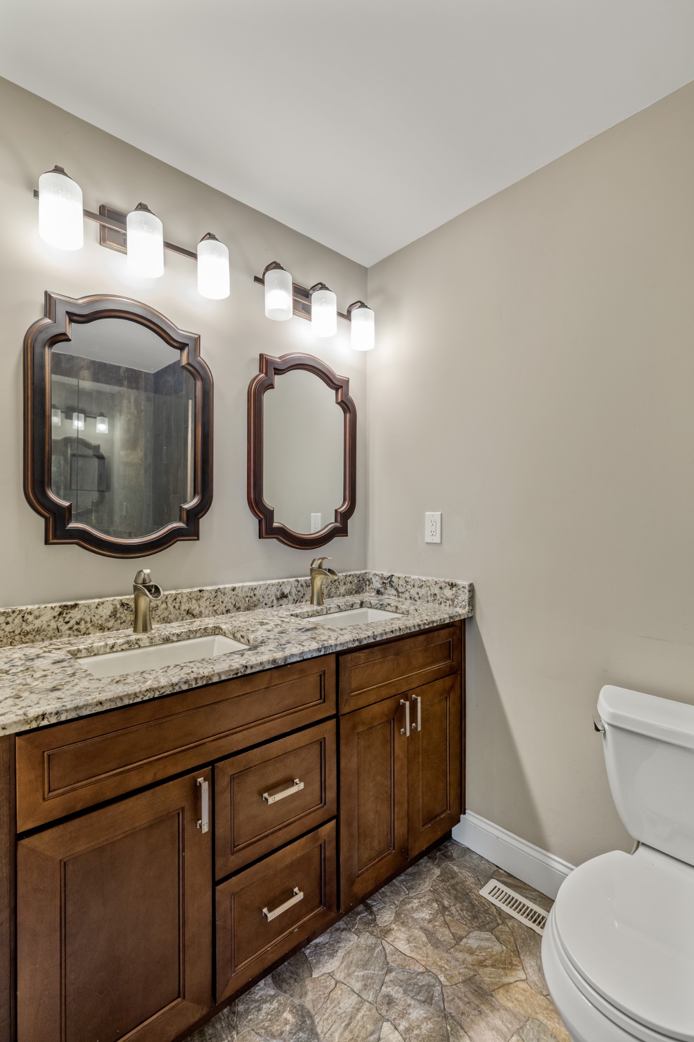 340 Double Log Cabin Road Lebanon, TN 37087 - Photo 22 of 50 a bathroom with a granite countertop toilet a sink and a mirror