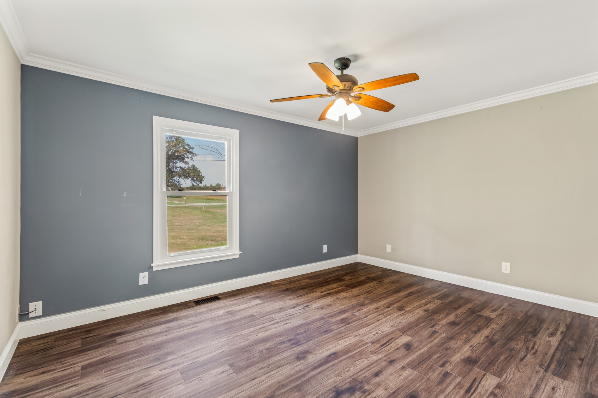 340 Double Log Cabin Road Lebanon, TN 37087 - Photo 25 of 50 a view of an empty room with window and wooden floor