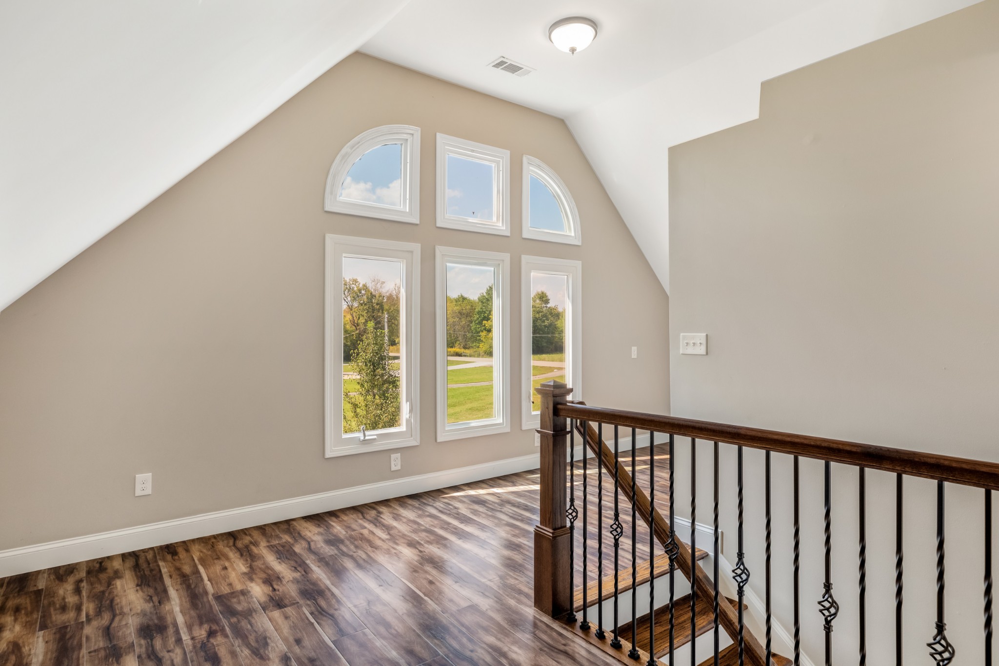 340 Double Log Cabin Road Lebanon, TN 37087 - Photo 31 of 50 a view of an entryway with wooden floor leading to a furnished livingroom and windows