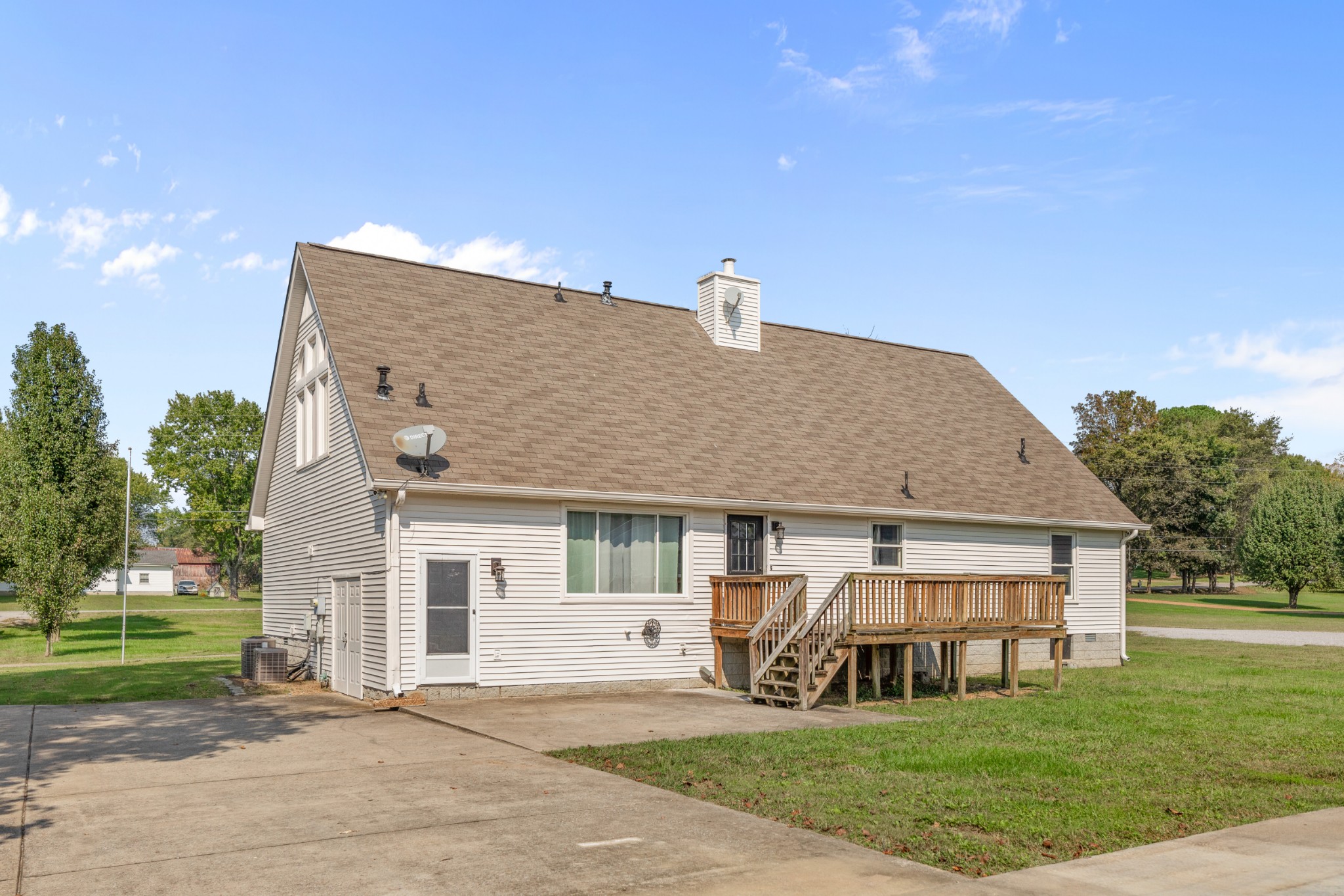 340 Double Log Cabin Road Lebanon, TN 37087 - Photo 41 of 50 a front view of a house with a garden and yard