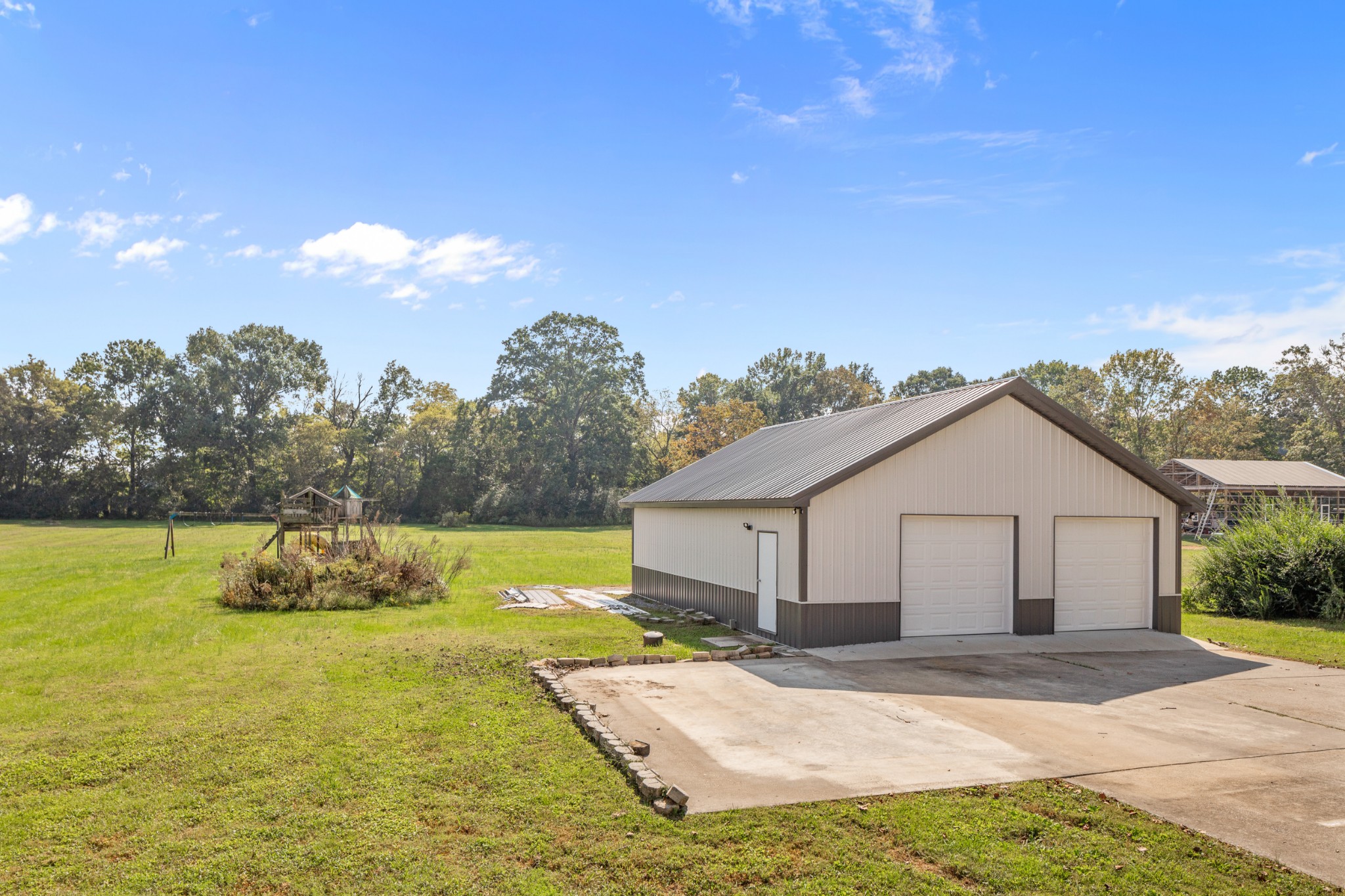 340 Double Log Cabin Road Lebanon, TN 37087 - Photo 44 of 50 a front view of a house with a garden and lake view