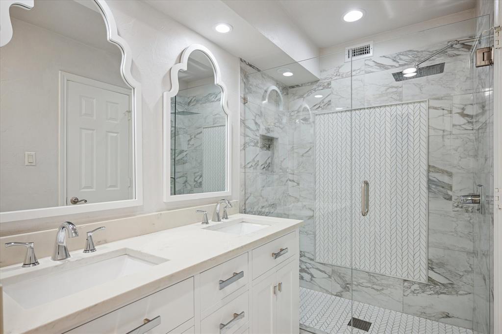 5565 Preston Oaks Road, Unit 262 Dallas, TX 75254 - Photo 12 of 19 a bathroom with a double vanity sink mirror and shower