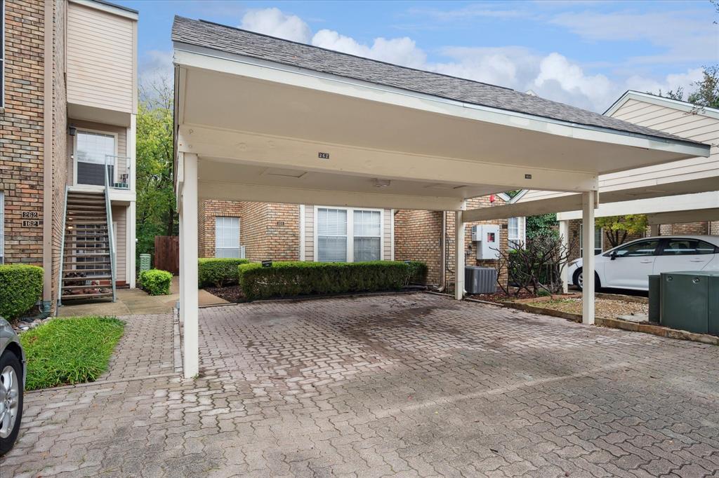 5565 Preston Oaks Road, Unit 262 Dallas, TX 75254 - Photo 5 of 19 a view of a house with a patio