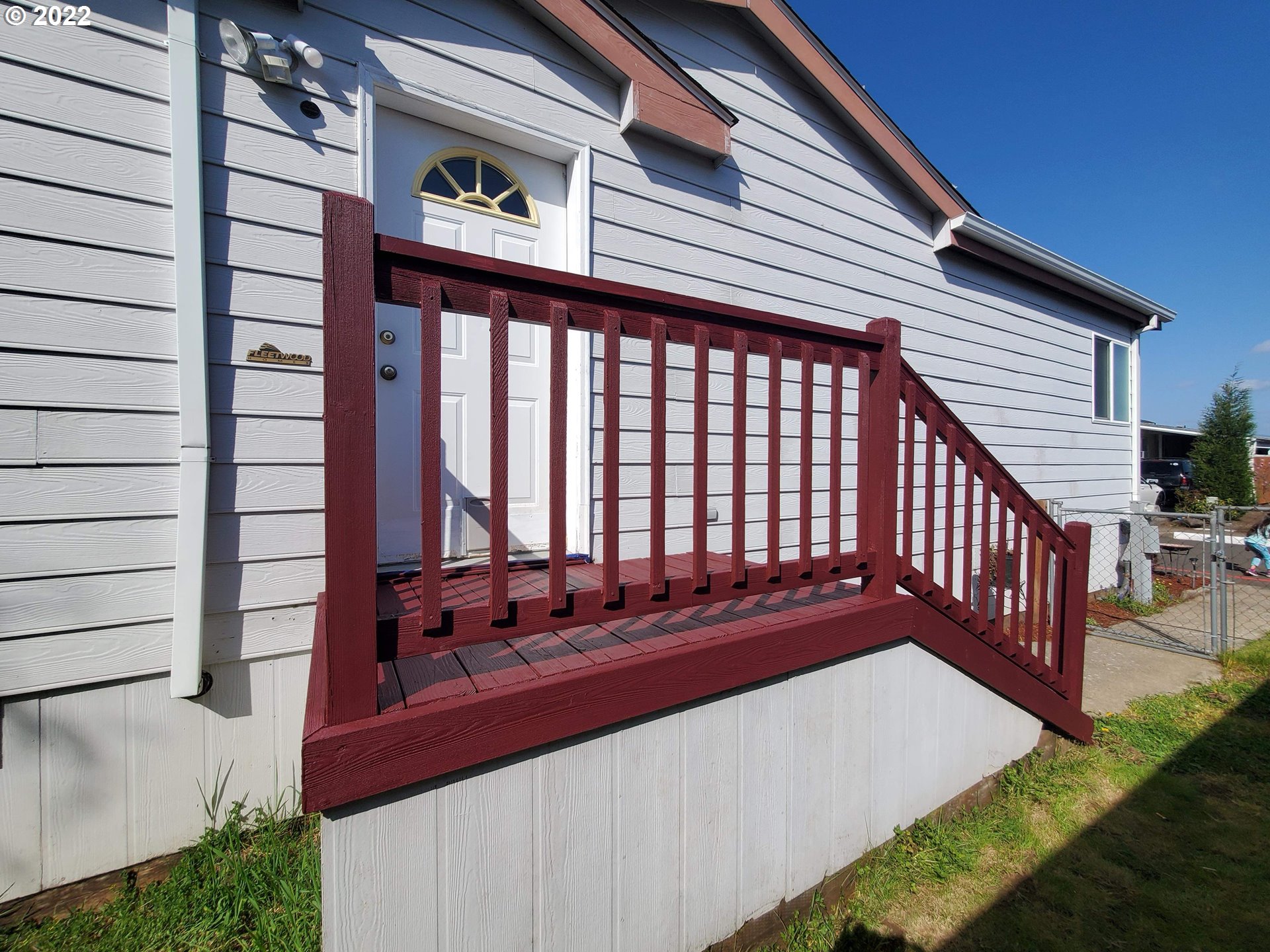 1949 Southeast Palmquist Road, Unit 77 Gresham, OR 97080 - Photo 1 of 30 a view of a backyard with sitting area