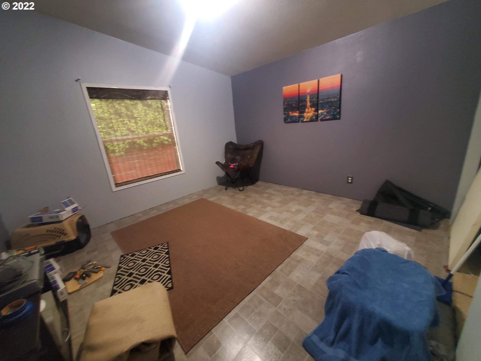 1949 Southeast Palmquist Road, Unit 77 Gresham, OR 97080 - Photo 12 of 30 a bedroom with a bed and window