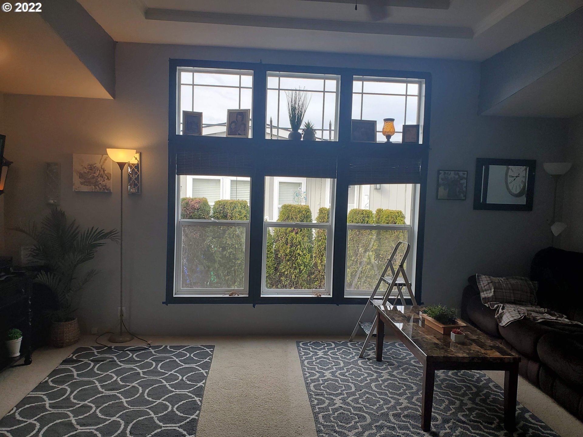 1949 Southeast Palmquist Road, Unit 77 Gresham, OR 97080 - Photo 17 of 30 a living room with furniture and a window