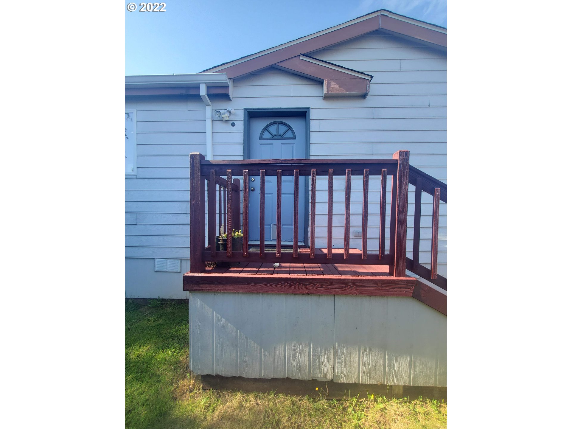 1949 Southeast Palmquist Road, Unit 77 Gresham, OR 97080 - Photo 2 of 30 a view of balcony with wooden floor