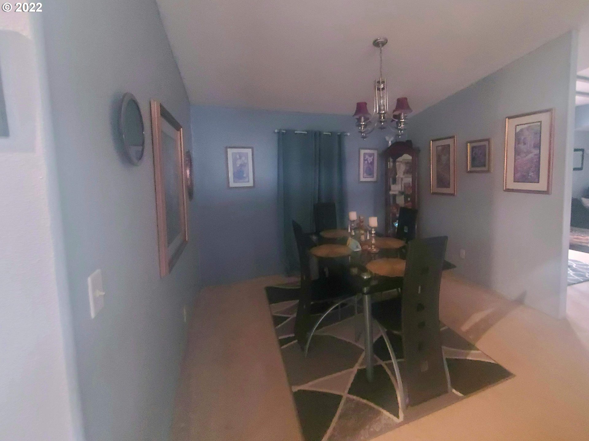 1949 Southeast Palmquist Road, Unit 77 Gresham, OR 97080 - Photo 22 of 30 a dining room with furniture and chandelier